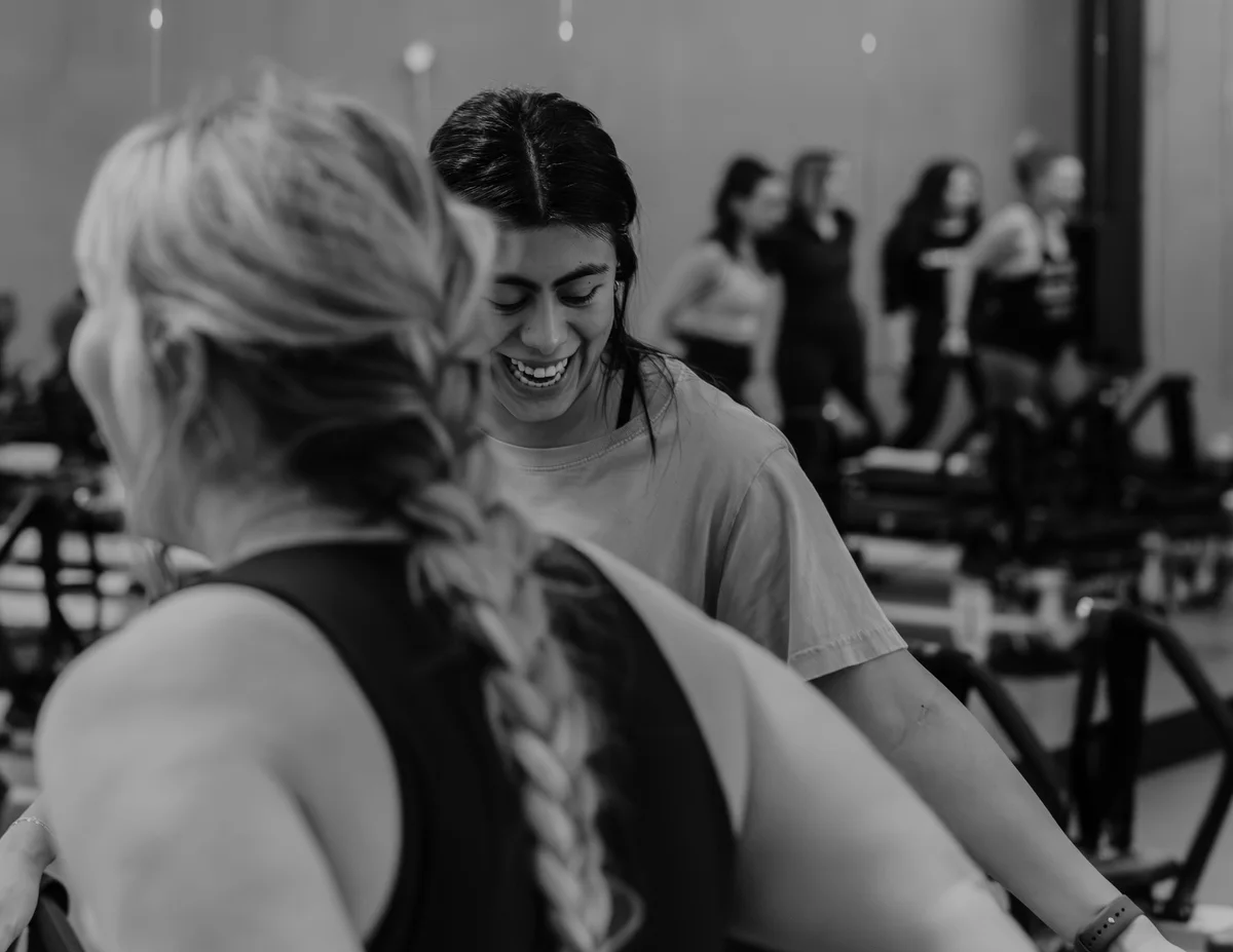 Two STRONG Kelowna members sharing a laugh in class